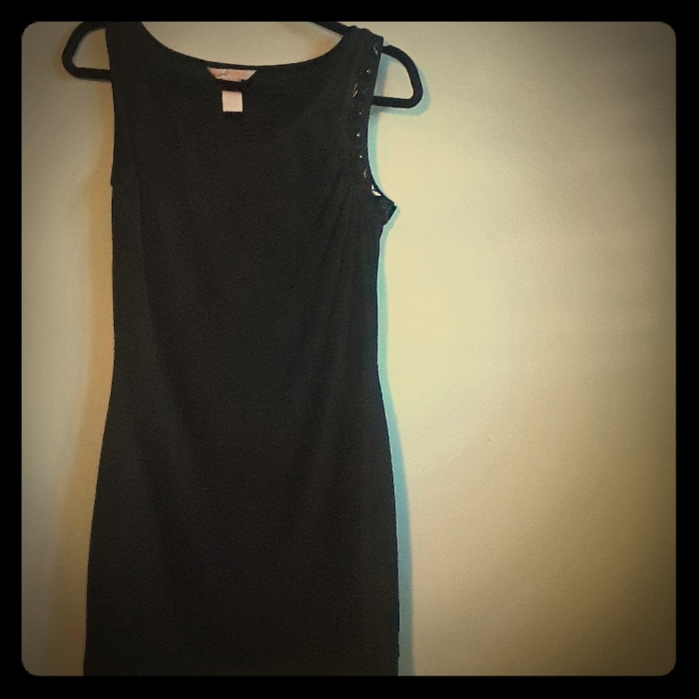 Little black dress, sleeveless.